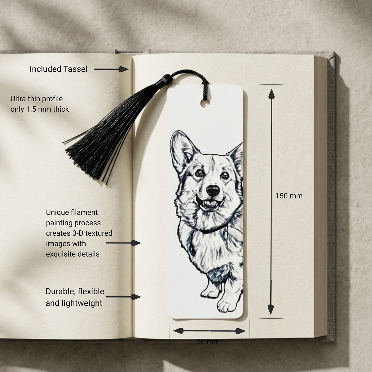 An open book displaying a bookmark with a black tassel and a detailed corgi illustration. White text callouts around the bookmark mention included tassel, ultra-thin profile, 3D textured image creation, and durability, with dimension arrows showing 150 mm length and 30 mm width.