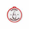 A round white holiday ornament with a red border and a central illustration of a gnome, featuring the text 'GNOME for HOLIDAYS' on a white background.